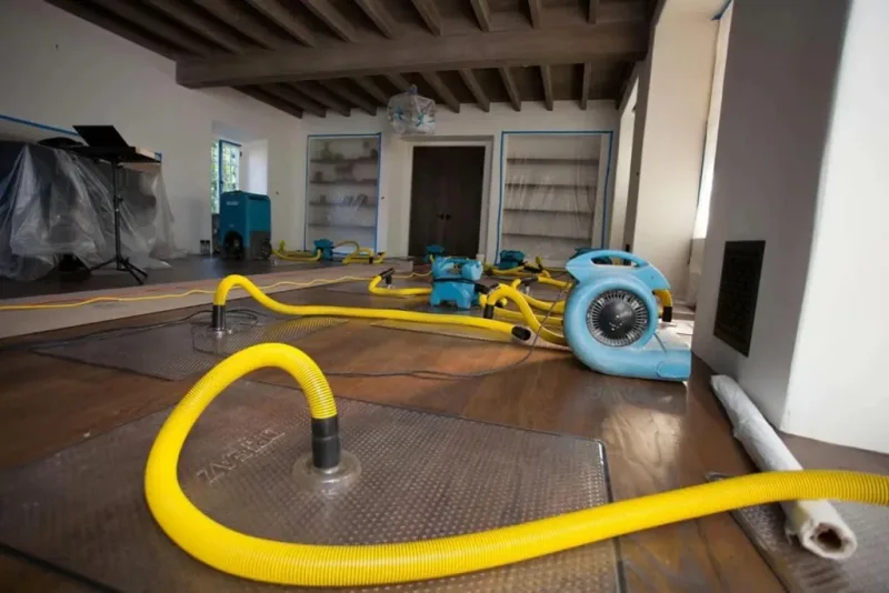 Hardwood floor injection drying mats extracting foundation slab moisture