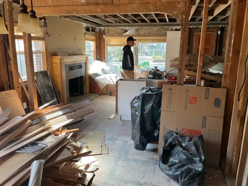 Exposed ceiling framing studs under high-velocity drying equipment